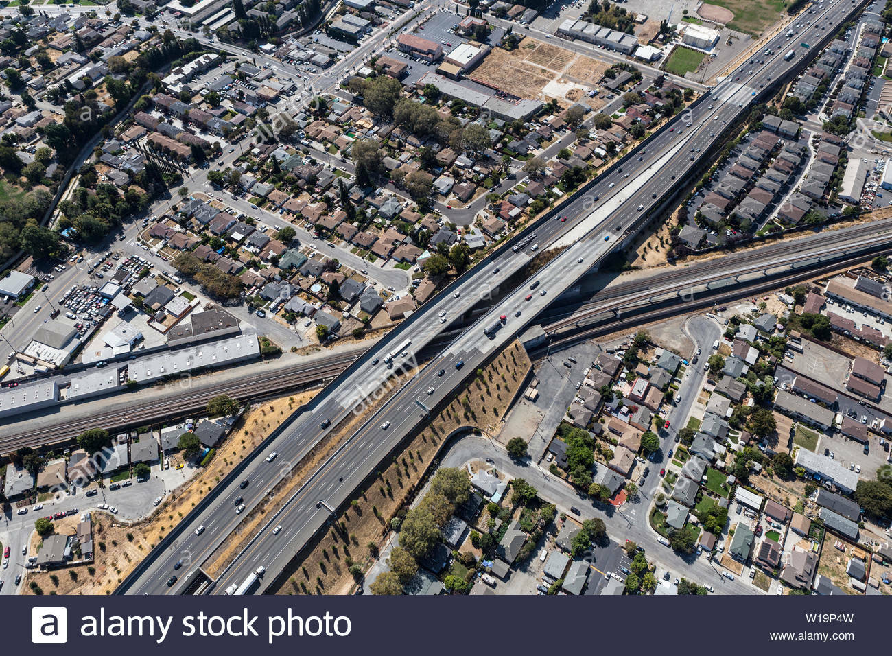 Aerial view of streets buildings and traffic along the 238 freeway railroad overpass near oakland california W19 P4 W